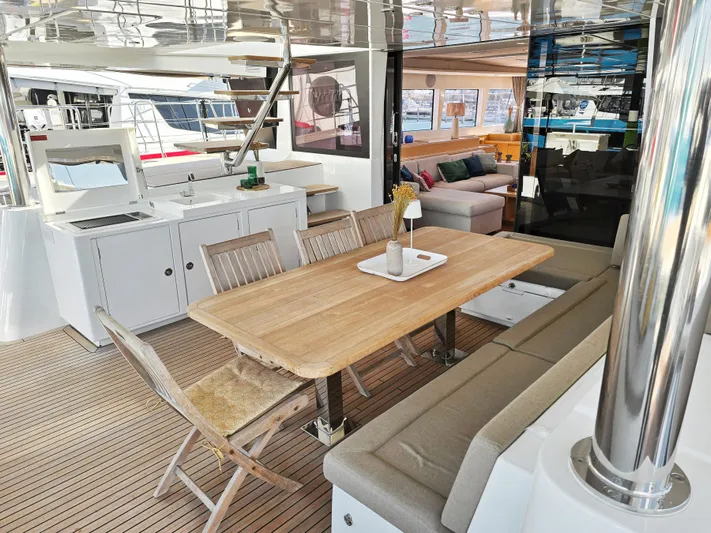 Firefly Yacht Photos Pics Luxurious Lagoon 620 NEO 2012 yacht interior with dining area and modern furnishings.