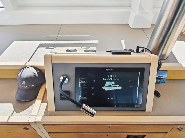 Firefly Yacht Photos Pics Control panel of a 2012 Lagoon 620 NEO yacht with ship control display.