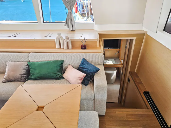 Firefly Yacht Photos Pics Luxurious Lagoon 620 NEO 2012 yacht interior with cozy seating and elegant decor.