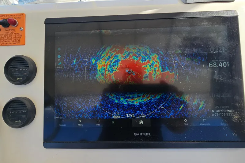  Yacht Photos Pics Garmin marine display on 2004 Luhrs 34 Convertible, showing radar and water temperature.