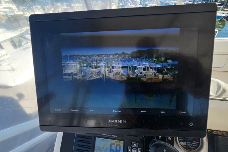  Yacht Photos Pics Garmin display on 2004 Luhrs 34 Convertible boat showing marina view.