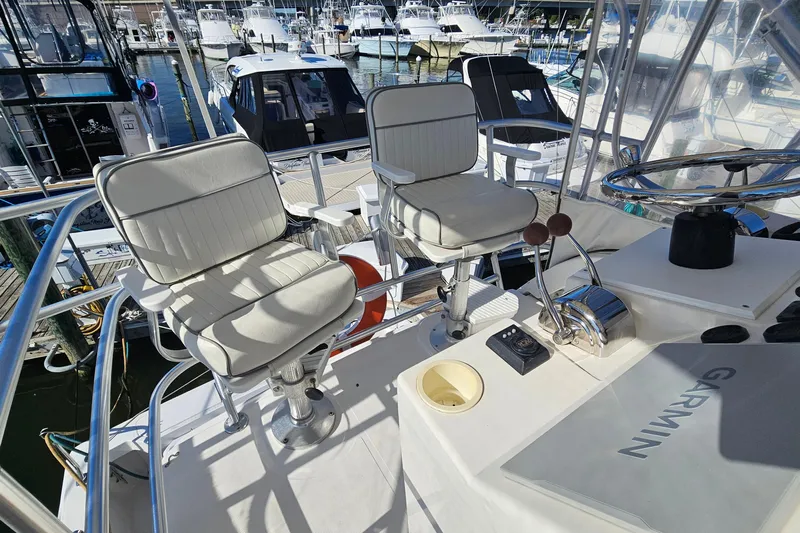  Yacht Photos Pics 2004 Luhrs 34 Convertible boat helm with dual seats and Garmin navigation.