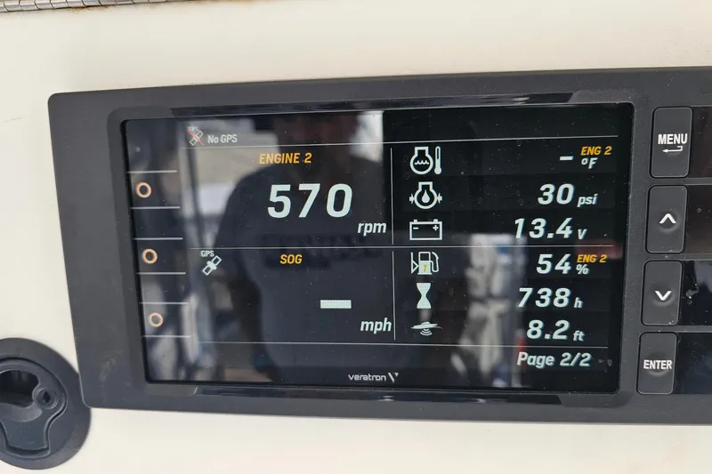  Yacht Photos Pics Luhrs 34 Convertible 2004 engine display showing RPM, PSI, voltage, and other metrics.