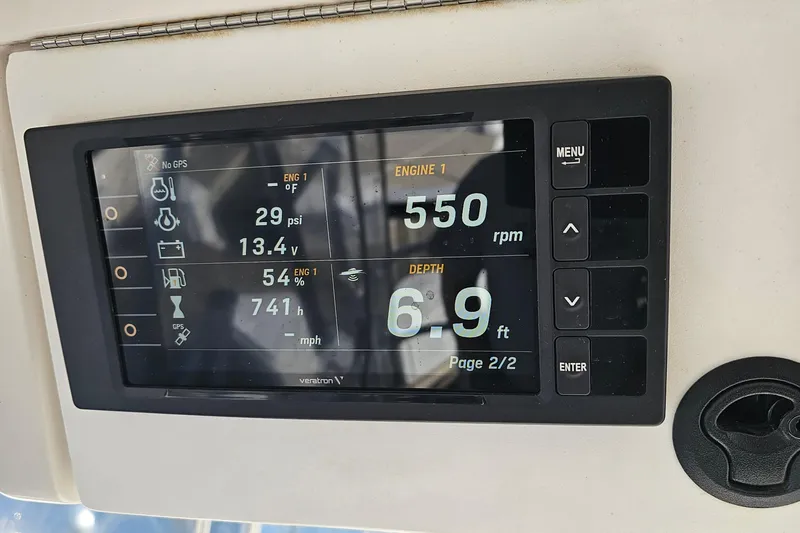  Yacht Photos Pics Display panel on 2004 Luhrs 34 Convertible showing engine and depth metrics.