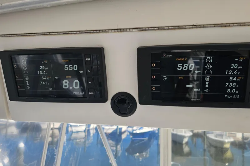  Yacht Photos Pics Luhrs 34 Convertible 2004 boat dashboard displaying engine and depth information.