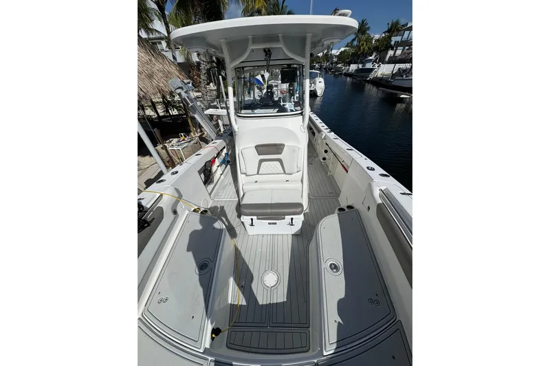  Yacht Photos Pics 2019 World Cat 295 CC boat interior with spacious deck and modern helm.