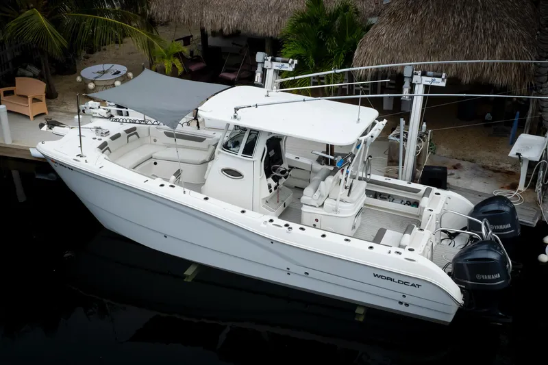  Yacht Photos Pics 2021 World Cat 295 CC boat docked, featuring dual Yamaha engines and spacious seating.
