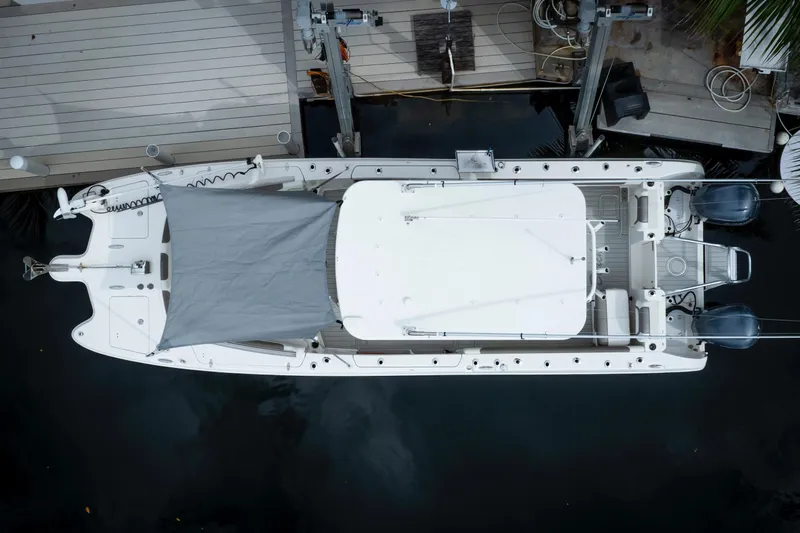  Yacht Photos Pics Aerial view of 2021 World Cat 295 CC boat docked, featuring dual engines and covered deck.