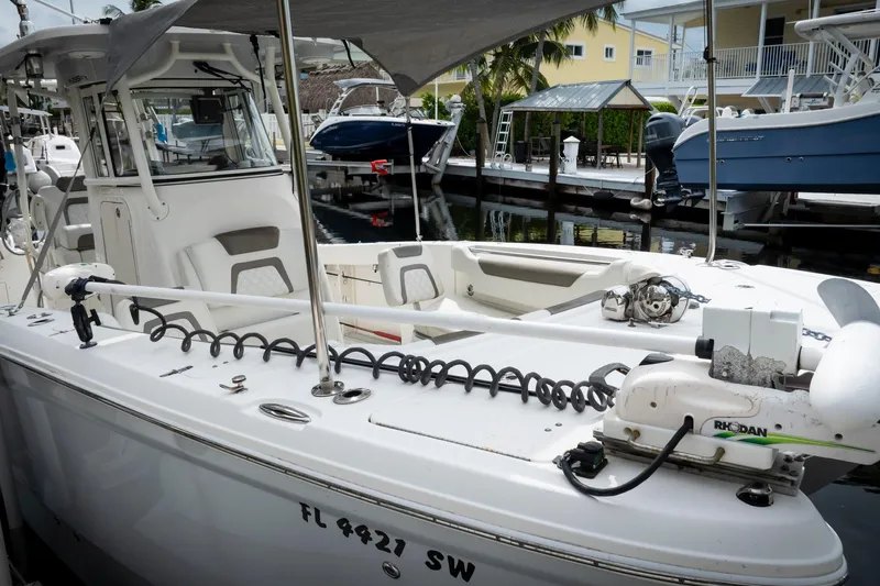  Yacht Photos Pics 2021 World Cat 295 CC boat docked, featuring spacious deck and modern equipment.