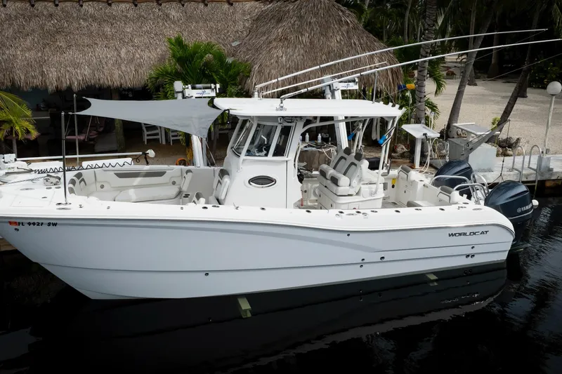  Yacht Photos Pics 2021 World Cat 295 CC boat docked, featuring dual engines and spacious seating.