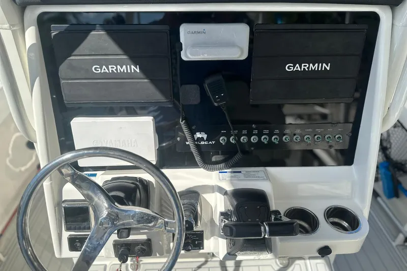  Yacht Photos Pics 2021 World Cat 295 CC boat dashboard with Garmin displays and Yamaha controls.
