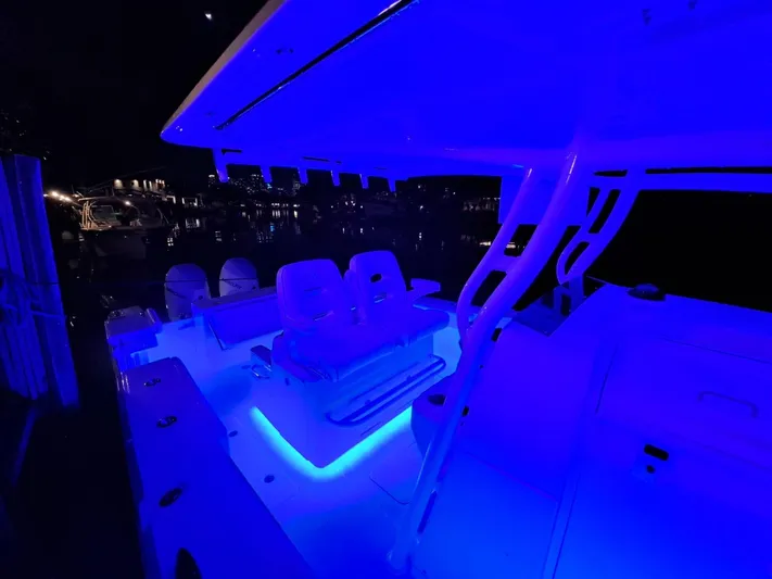  Yacht Photos Pics 2024 Southport 30 FE boat with blue LED deck lighting at night.