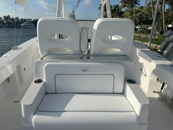  Yacht Photos Pics 2024 Southport 30 FE boat interior with white seating and cup holders.