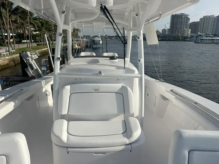  Yacht Photos Pics 2024 Southport 30 FE boat interior with white seating and waterfront view.