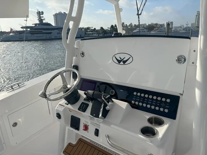  Yacht Photos Pics 2024 Southport 30 FE boat helm with modern controls and waterfront view.