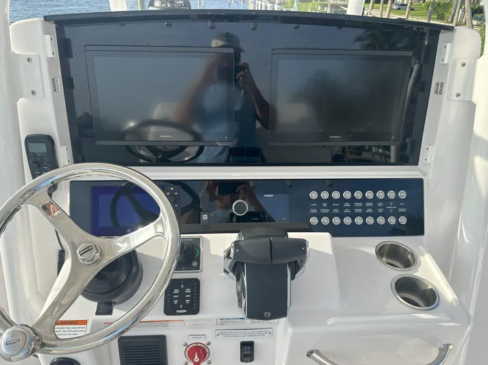  Yacht Photos Pics 2024 Southport 30 FE boat dashboard with dual screens and steering wheel.