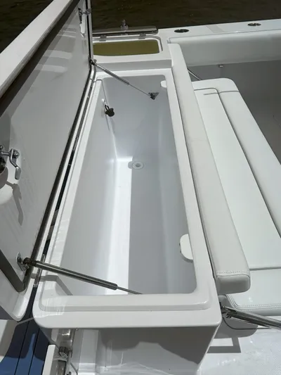  Yacht Photos Pics 2024 Southport 30 FE boat with open storage compartment.