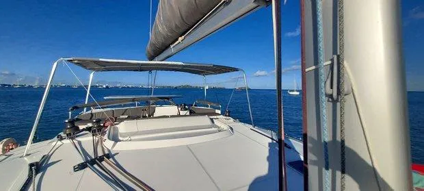 Katarina Yacht Photos Pics 2010 Lagoon 440 catamaran sailing on a clear blue sea under a sunny sky.