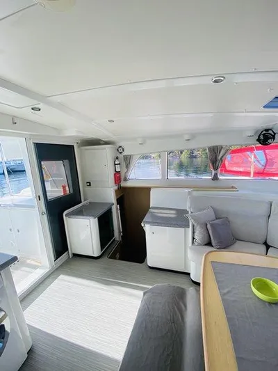 Katarina Yacht Photos Pics Interior of 2010 Lagoon 440 catamaran, featuring modern seating and dining area.
