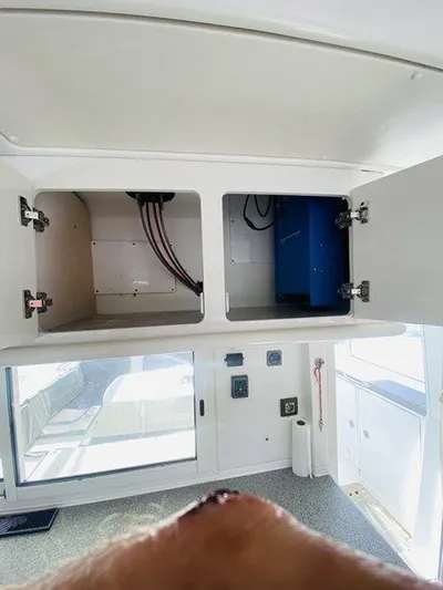 Katarina Yacht Photos Pics Interior view of a 2010 Lagoon 440 catamaran showing open storage compartments.