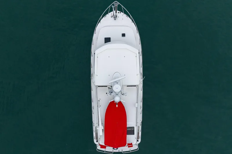 Big Red Yacht Photos Pics Aerial view of 2007 American Tug 41 boat with red cover on deck.