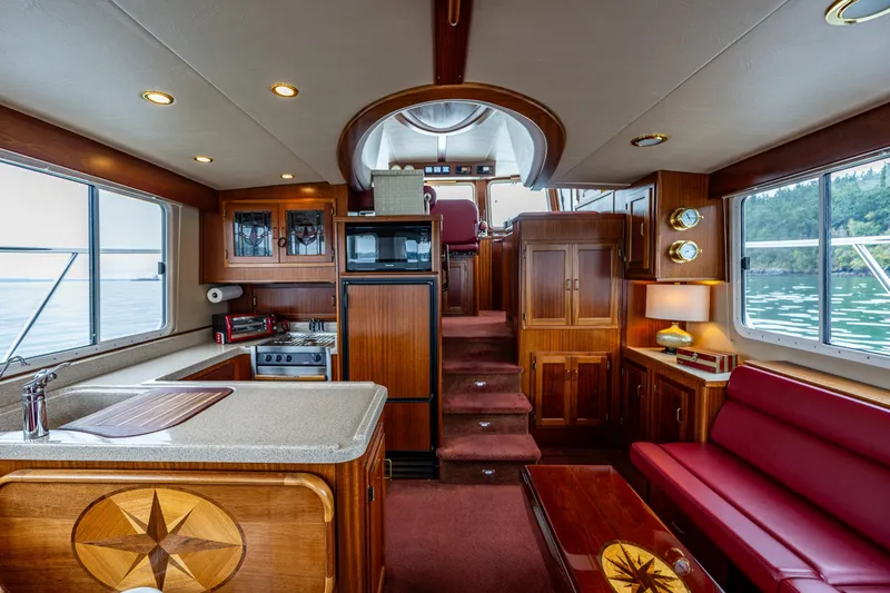 Big Red Yacht Photos Pics Luxurious interior of 2007 American Tug 41 with wood finishes and modern amenities.