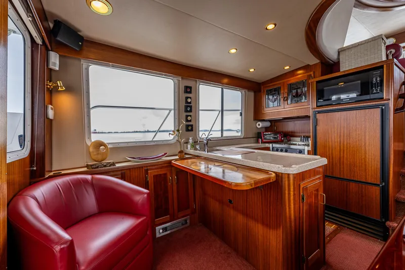 Big Red Yacht Photos Pics Luxurious interior of 2007 American Tug 41 with wood finishes and modern amenities.