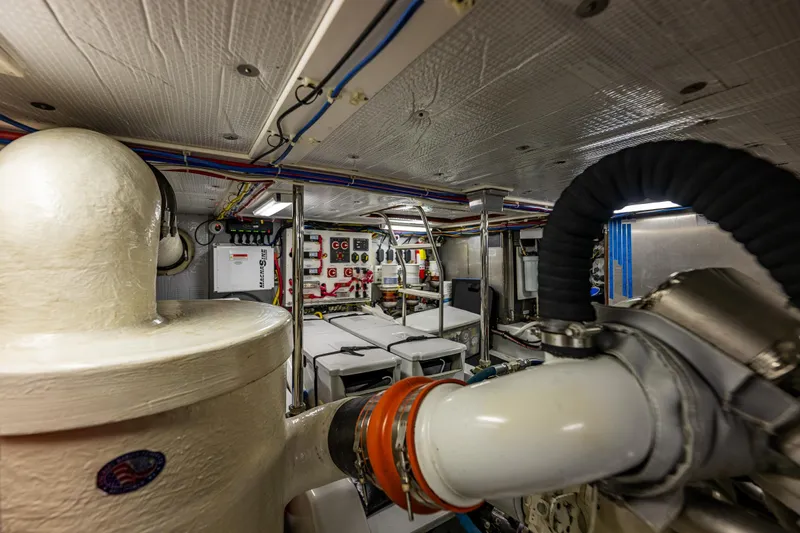 Big Red Yacht Photos Pics Engine room of a 2007 American Tug 41, showcasing machinery and control panels.