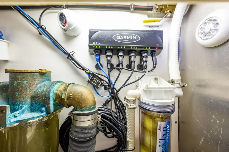 Big Red Yacht Photos Pics Engine room of 2007 American Tug 41 with Garmin GPS and filtration system.