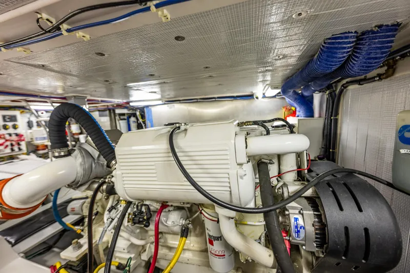 Big Red Yacht Photos Pics Engine room of a 2007 American Tug 41, showcasing detailed mechanical components.