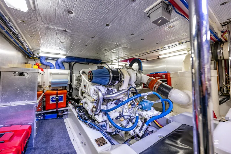 Big Red Yacht Photos Pics Engine room of a 2007 American Tug 41, featuring a well-maintained engine and organized layout.