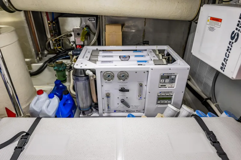 Big Red Yacht Photos Pics Engine room of 2007 American Tug 41 with marine equipment and supplies.