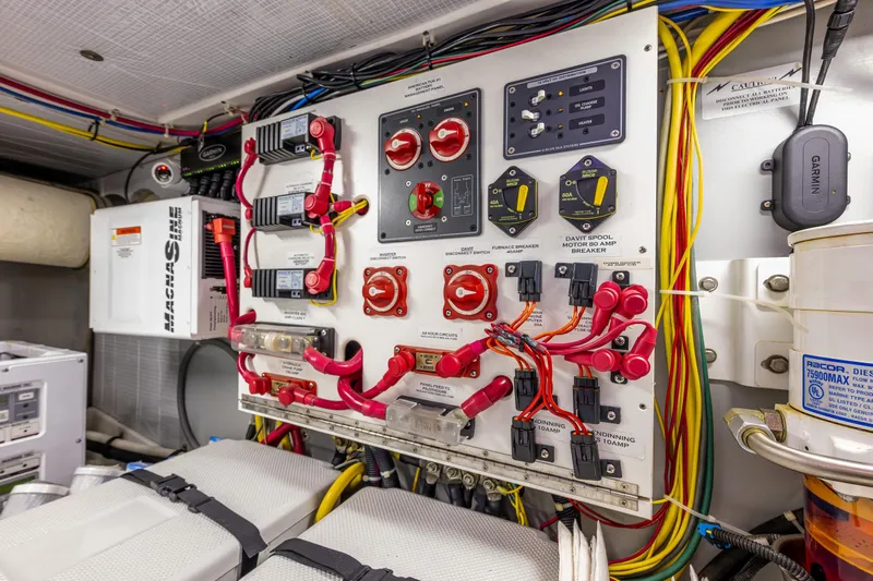 Big Red Yacht Photos Pics Electrical panel in a 2007 American Tug 41, featuring wiring and control switches.