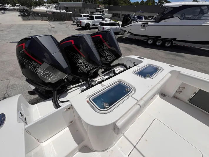  Yacht Photos Pics 2023 Fountain 38 Tournament Edition boat with triple 450 horsepower engines at a marina.