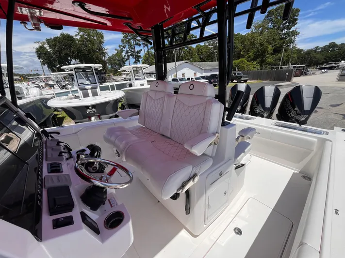  Yacht Photos Pics 2023 Fountain 38 Tournament Edition boat interior with luxurious seating and advanced controls.
