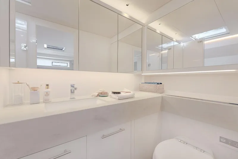 Big Picture Yacht Photos Pics Luxurious bathroom in 2024 Lagoon SIXTY 5 yacht, featuring sleek design and modern amenities.