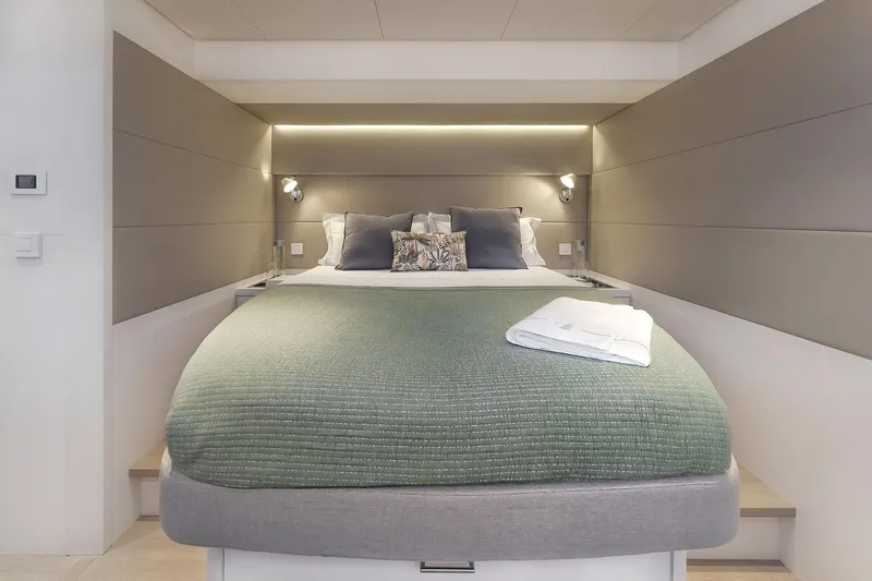 Big Picture Yacht Photos Pics Luxurious bedroom interior of 2024 Lagoon SIXTY 5 yacht with modern design.