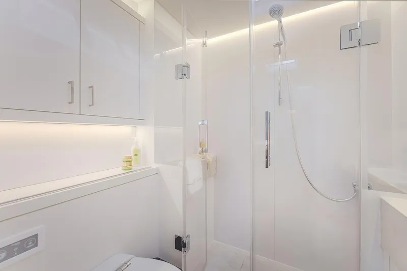 Big Picture Yacht Photos Pics Modern bathroom in 2024 Lagoon SIXTY 5 yacht with sleek shower and cabinetry.