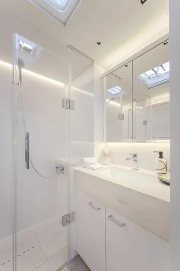 Big Picture Yacht Photos Pics Luxurious bathroom in 2024 Lagoon SIXTY 5 yacht with modern shower and sleek vanity.