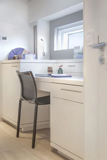 Big Picture Yacht Photos Pics Modern interior of 2024 Lagoon SIXTY 5 yacht with sleek desk and chair.