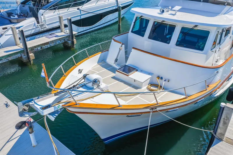 Sugar Yacht Photos Pics 2008 DeFever 52 Euro yacht docked at marina, showcasing sleek design and spacious deck.