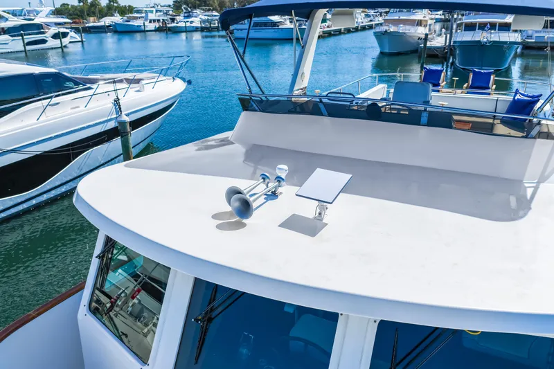 Sugar Yacht Photos Pics 2008 DeFever 52 Euro yacht docked at marina, surrounded by other boats.