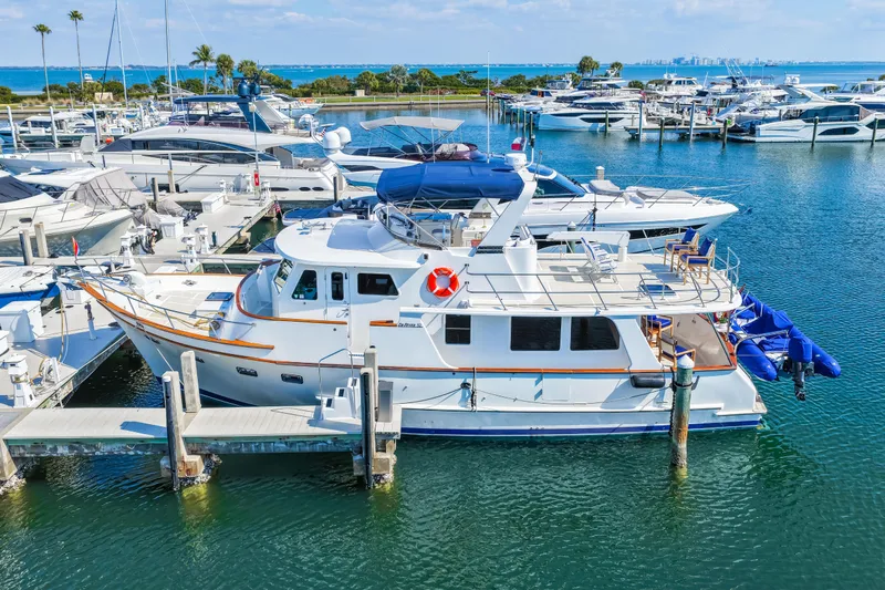 Sugar Yacht Photos Pics 2008 DeFever 52 Euro yacht docked in a marina with other boats.