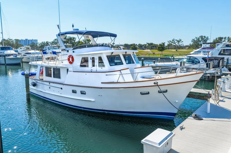 Sugar Yacht Photos Pics 2008 DeFever 52 Euro yacht docked at marina under clear blue sky.