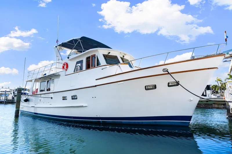 Sugar Yacht Photos Pics 2008 DeFever 52 Euro yacht docked under a clear blue sky.