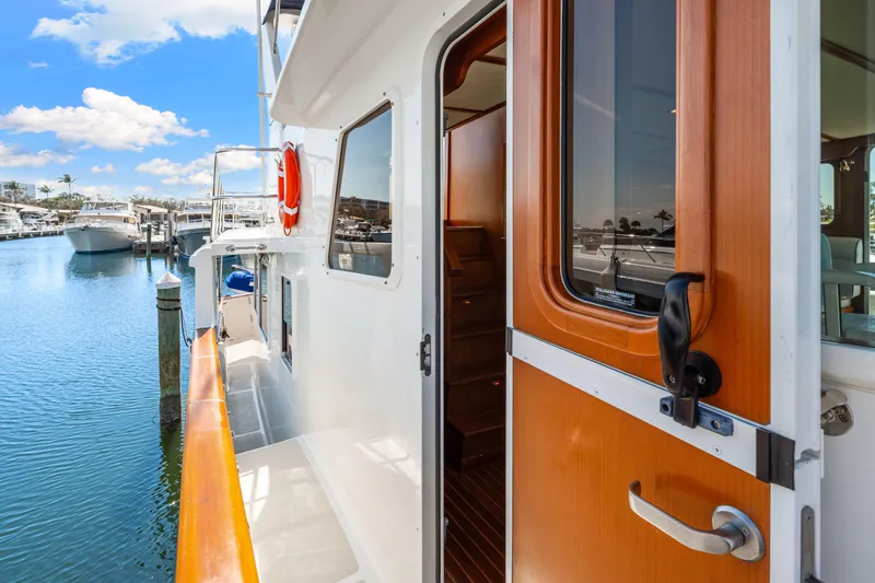 Sugar Yacht Photos Pics 2008 DeFever 52 Euro yacht docked, showcasing side deck and open cabin door.