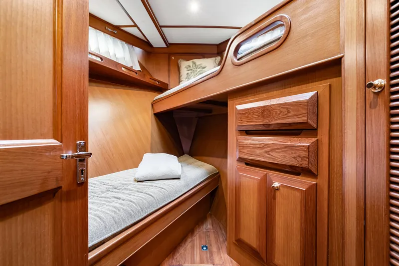 Sugar Yacht Photos Pics Cozy wooden cabin interior of 2008 DeFever 52 Euro yacht with bunk beds.