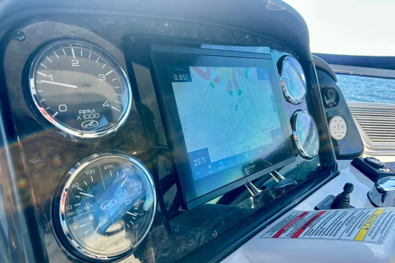  Yacht Photos Pics Dashboard of 2009 Sea Ray 44 Sedan Bridge with navigation display and gauges.