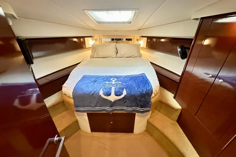  Yacht Photos Pics Luxurious cabin interior of 2009 Sea Ray 44 Sedan Bridge yacht with cozy bedding.