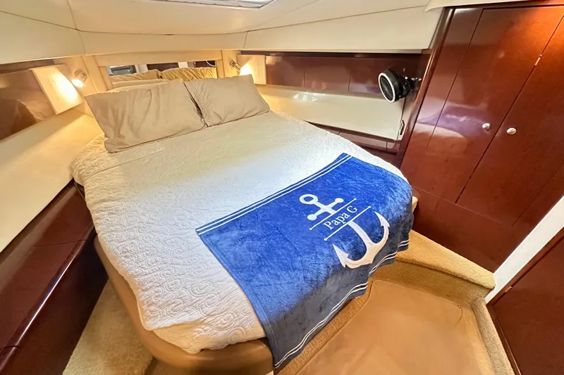  Yacht Photos Pics Luxurious 2009 Sea Ray 44 Sedan Bridge cabin with cozy bed and nautical decor.